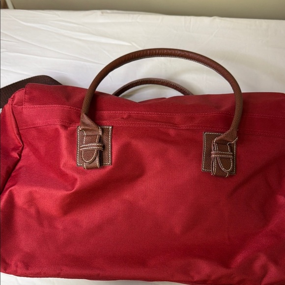 Red and Brown Travel Bag with Adjustable Strap and Sturdy Design - Picture 4 of 10